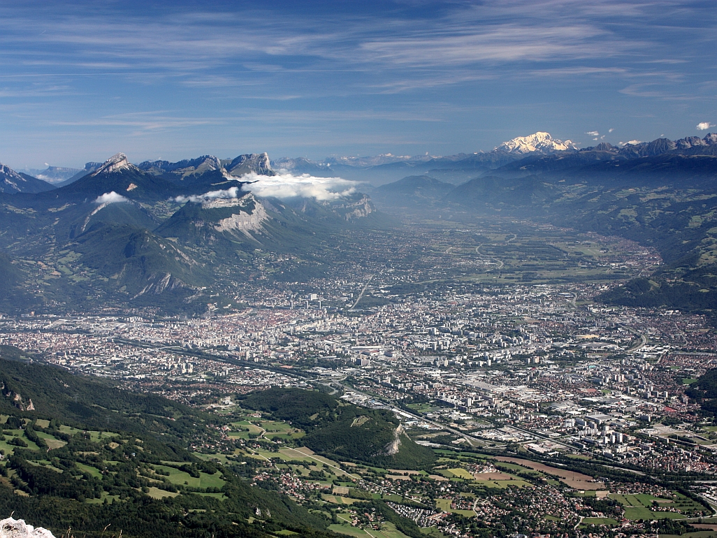 Photo of the city of Grenoble taken from Pic St Michel in the Vercors Massif, showing the Chartreuse Massif, the Grésivaudan valley and the Mont Blanc