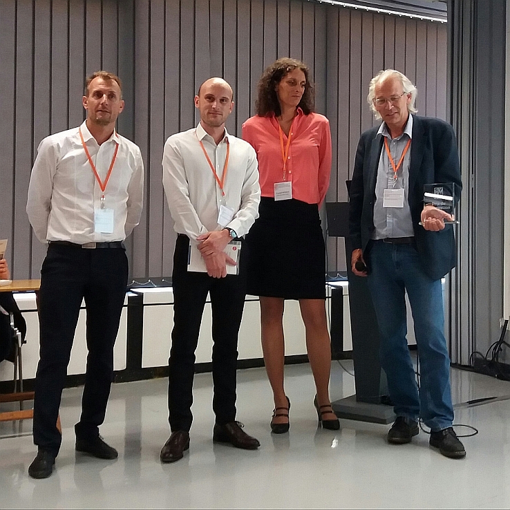 Photo of the jury and Polygon Physics' president Pascal Sortais holding the SFV Innovation Award 2017